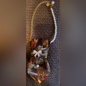 Woman’s Tie-Floral Bow Clutch with Pearl and Gold Chain